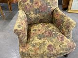 an old chair with floral upholstered upholstered upholstered upholstered upholstered up