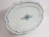 a blue and white platter with a blue design on it