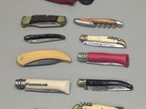 a lot of different types of knives on the table