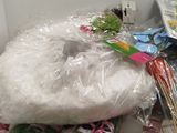 a pile of plastic wrapped items on a counter