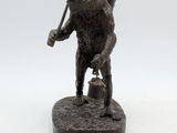 a statue of a bear holding a bucket and a baseball bat