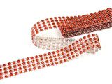two rolls of red and white beaded ribbon on a white background