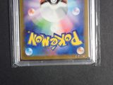 a close up of a pokemon card in a plastic case