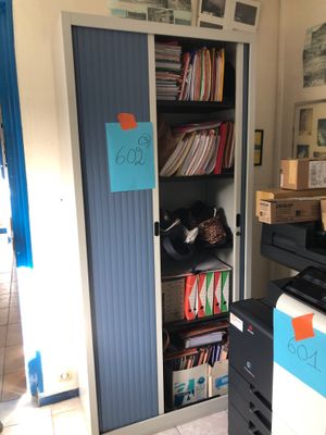 an image of a room with a printer and a cabinet