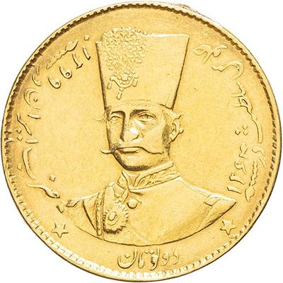 a close up of a gold coin with an image of a man wearing a hat