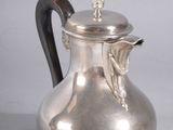 an image of a silver coffee pot with a handle on a white background