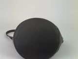 black leather round purse with zipper closure on a white background