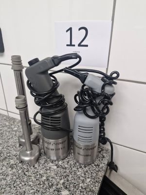 two different types of hair dryers sitting on a counter