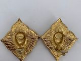 pair of gold tone earrings with a diamond shaped design