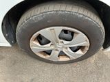 a close up of a tire on a car ' s rim
