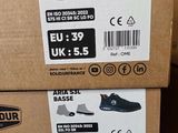 boxes of shoes are stacked on top of each other on a shelf