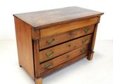 an image of a wooden chest of drawers with brass handles