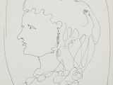 a black and white drawing of a woman ' s face in profile