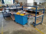 a large room with many tables and carts in it