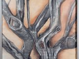 painting of a tree in a frame on a wall