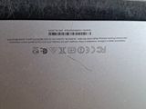 a close up of a laptop with a bar code on the back