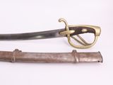 an old sword with a brass handle and a wooden handle