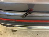 a remote control attached to the bumper of a car