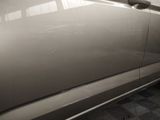 a close up of a car door handle on the side of the car
