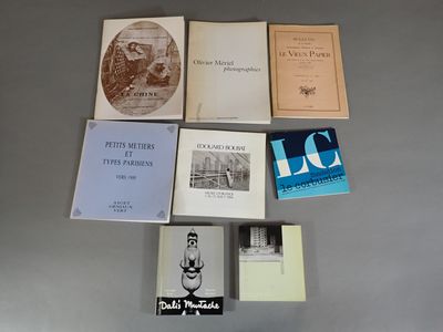 several books are arranged on a table in a circle
