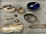 a tray that has silver spoons and spoons in it