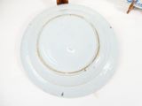 a white plate with a blue and white design on it