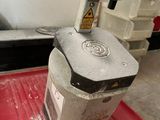 a machine that is sitting on top of a red mat