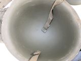 a person holding a cup with a spoon inside of it