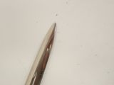 a pair of scissors sitting on a white surface