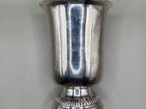 a silver vase that is on the wall
