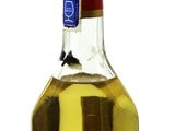 a bottle of olive oil sitting on a table