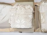 two boxes that have lace on them in them