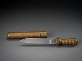 a knife and a wooden handle on a table