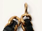 a pair of gold chains that are connected to each other