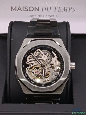 a watch that is sitting in a box on a table