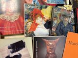 many books that are sitting on a table together