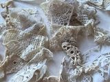 a lot of doily on a white table cloth