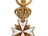 Gros plan sur une médaille d'or ornée d'une couronne