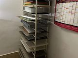 a room with a bunch of shelves and a table