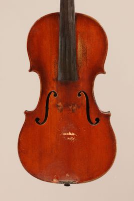 an old violin with a bow hanging from it ' s back