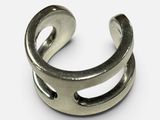 a close up of a metal ring on a white surface