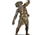 an image of a bronze statue of a man holding a torch