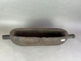 a small metal container with a handle on a white surface