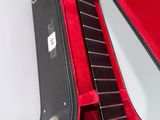 a guitar in a case sitting on a table