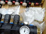 a box that has a bunch of valves and gauges in it