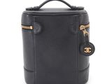 a chanel black leather cosmetic case with gold hardware