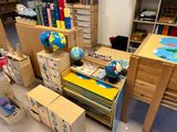 a desk with a globe on top of it in a room