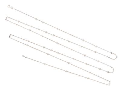 a set of five silver chain necklaces and a bracelet
