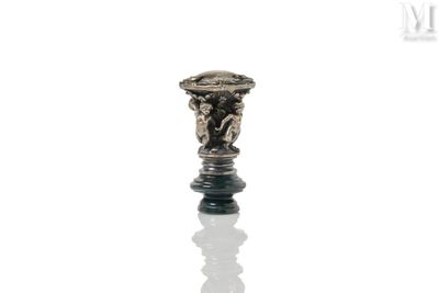 an image of a silver candle holder on a reflective surface