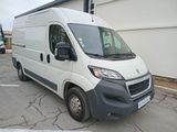 a white van that is parked in a parking lot